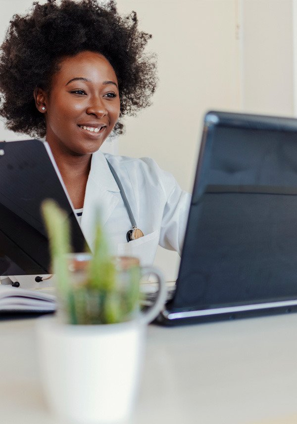 Telehealth provider A provider giving telehealth services over a laptop.